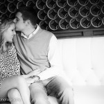 The groom gently kisses his bride on her forehead.