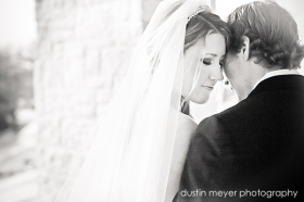 A black and white wedding photo of a bride and groom at Barton Creek Resort in Austin, TX.